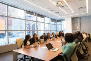 staff around a board room table